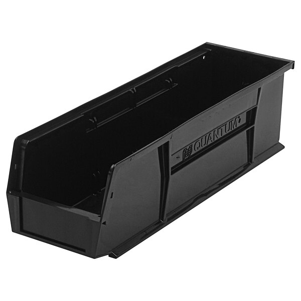 A black plastic Quantum hanging bin with a handle.