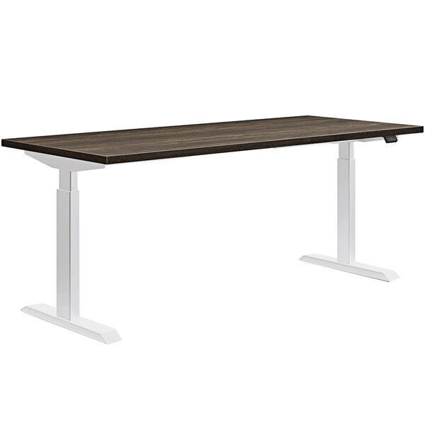 A HON Florence Walnut and Designer White desk with white legs.