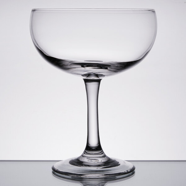 An Anchor Hocking margarita glass with a stem on a table.