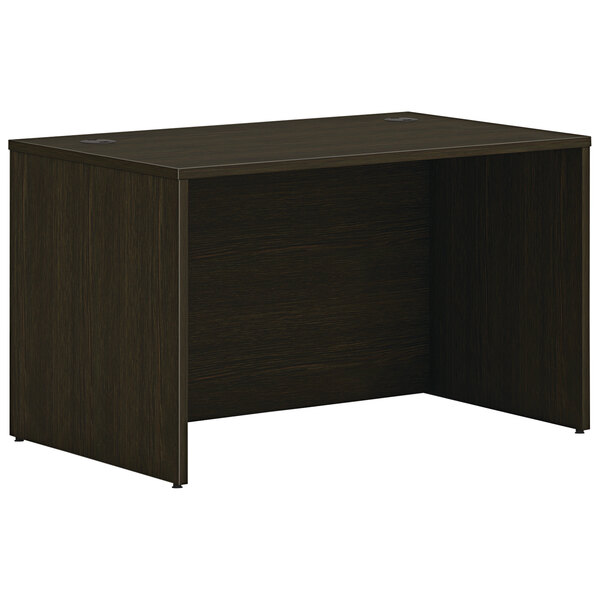 A dark wood HON desk shell with a Java Oak top.