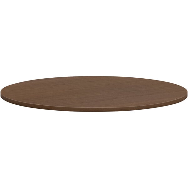 A round brown HON conference table top.