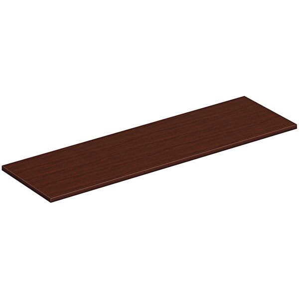 A rectangular wooden surface in a traditional mahogany finish.