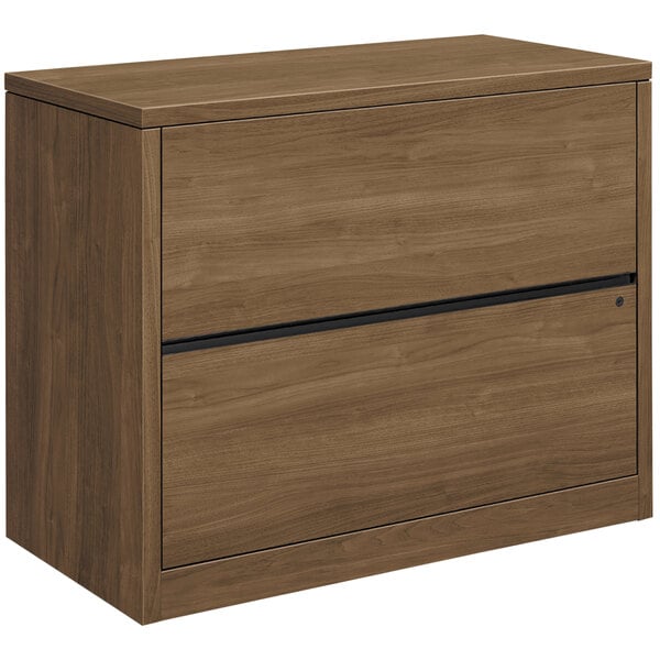 A brown wooden HON 10500 Series lateral file cabinet with two drawers.