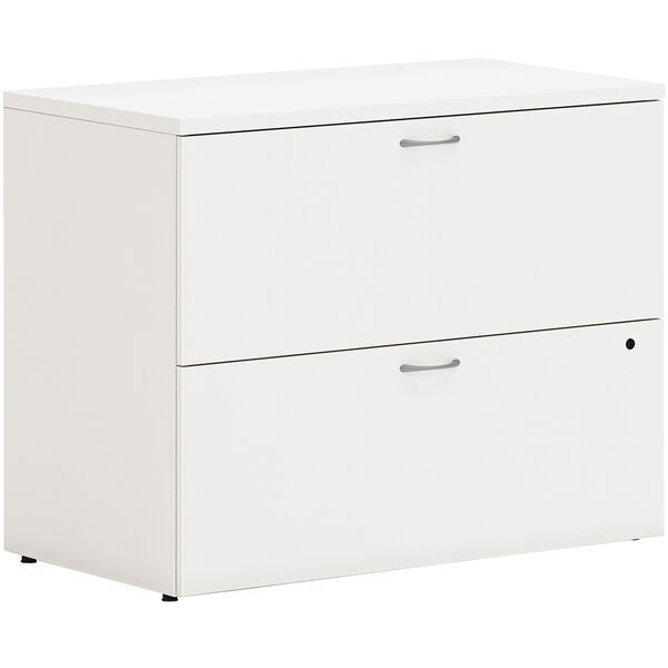 A white HON lateral file cabinet with two drawers.