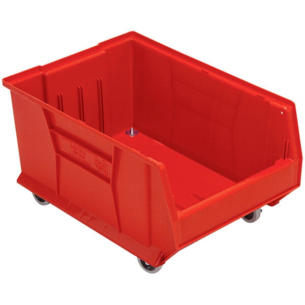 A Quantum red plastic storage bin with wheels.