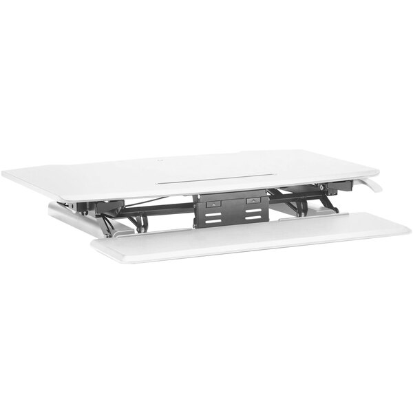 A white desk top with a metal tray on top.