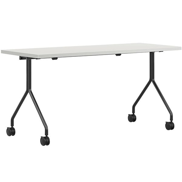 A white rectangular HON mesh laminate nesting table with black legs.