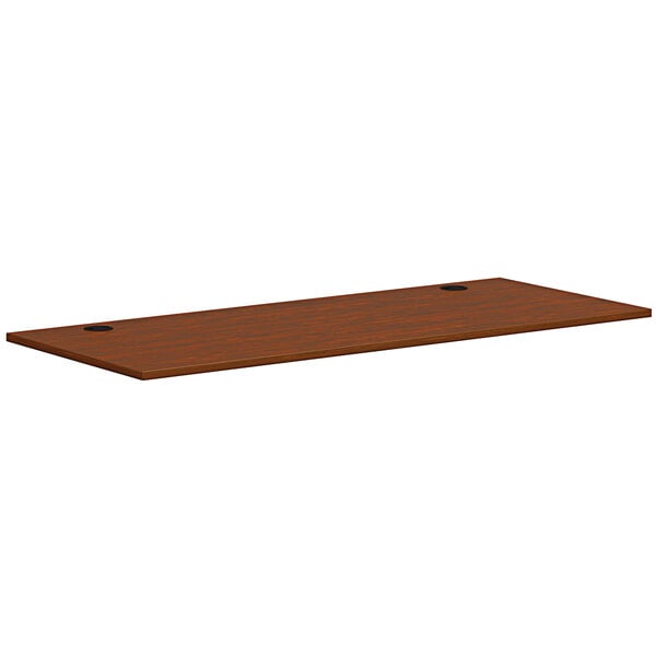 A brown rectangular HON worksurface.