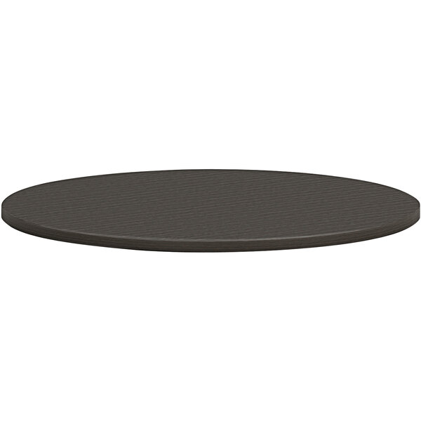 A black round HON conference table top.