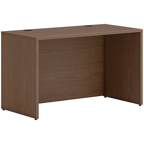 A sepia walnut laminate credenza shell on a table.