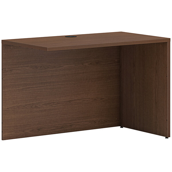 A sepia walnut desk return shell.