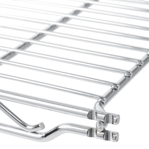 A silver rack with a metal grid.