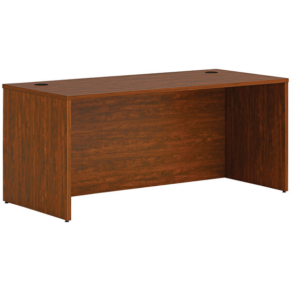 A HON russet cherry laminate desk shell.