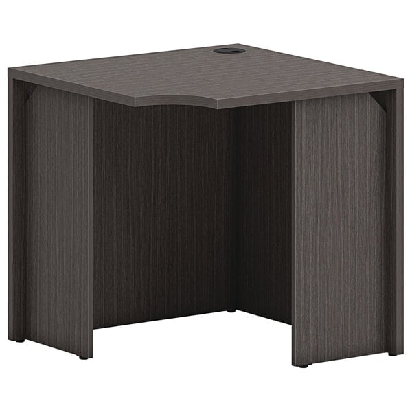 A black HON 30" square corner desk shell with a hole in the top.
