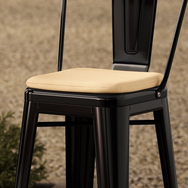 A tan fabric magnetic cushion designed for alloy barstools.