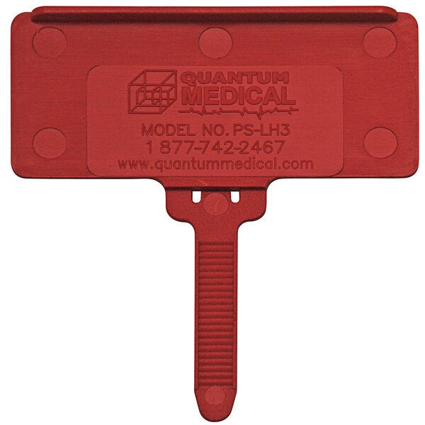 A red plastic Quantum medical label tag.