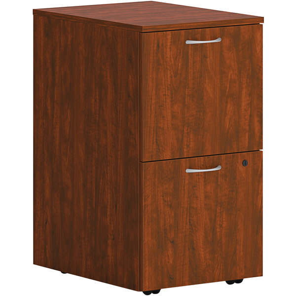 A HON russet cherry wooden file cabinet with 2 drawers.
