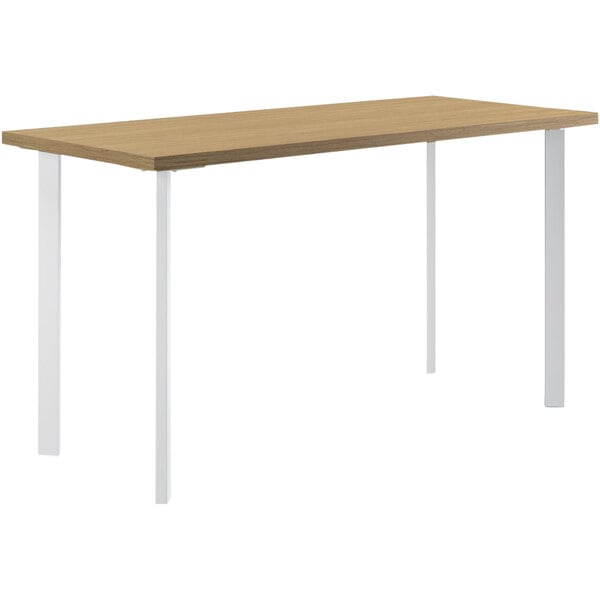 A rectangular HON desk with white legs and a natural wood surface.