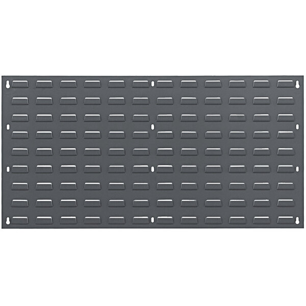 A Quantum grey steel louvered panel with rectangular holes.