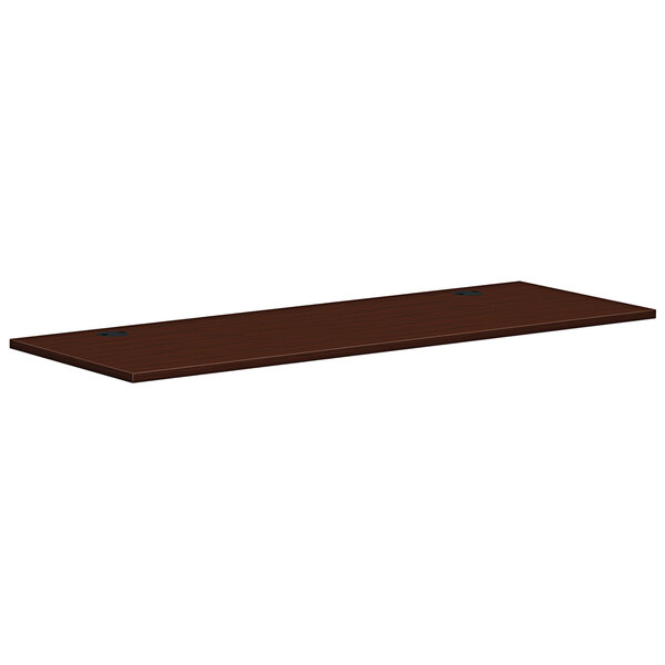 A brown rectangular HON worksurface.