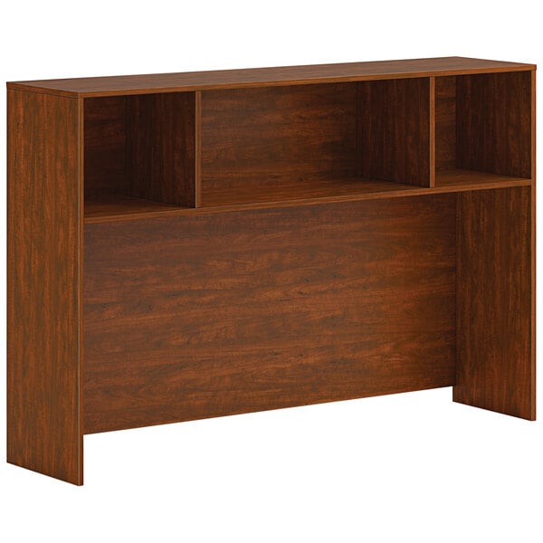 A HON russet cherry laminate open desk hutch with shelves.