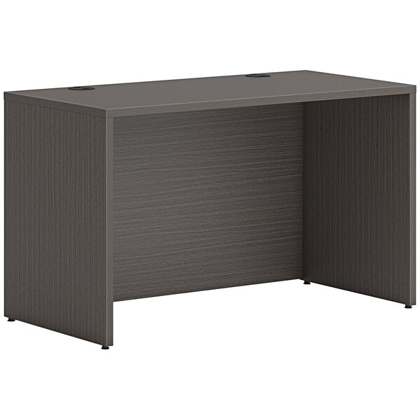 A slate teak laminate desk shell by HON.