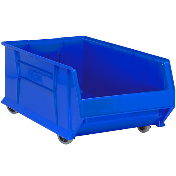 A Quantum blue plastic storage bin with wheels.