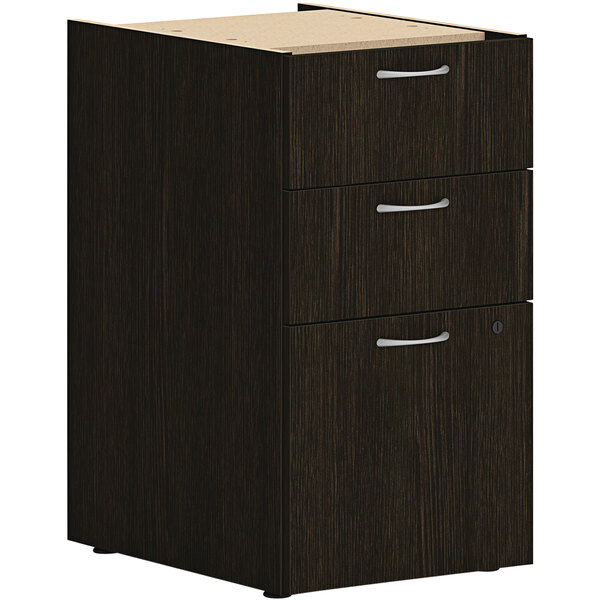 A black file pedestal with a wooden top and silver handles.