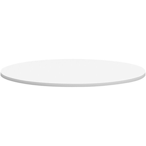 A white round HON conference table top.