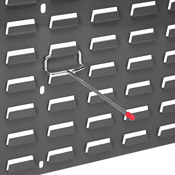 A Quantum single rod for louvered panel with a red hook on it.