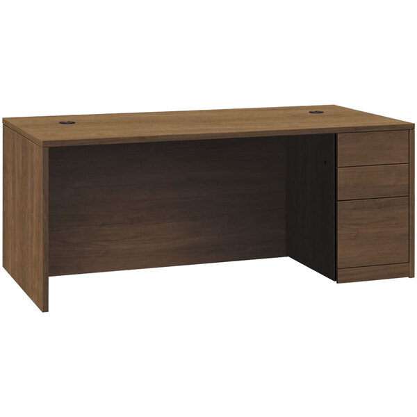 A brown wooden HON Pinnacle desk with two box drawers and a file drawer.