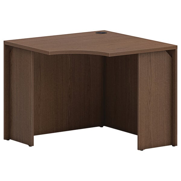 A brown HON square corner desk shell.