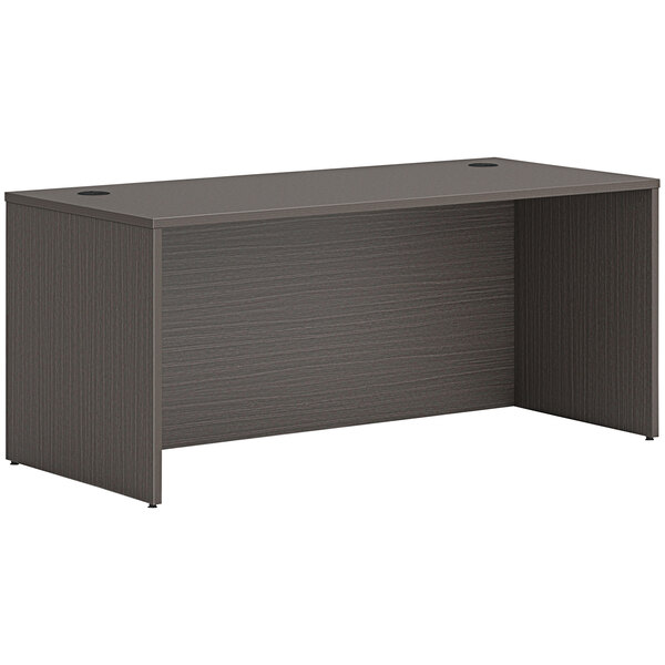 A black HON office desk with a gray finish.