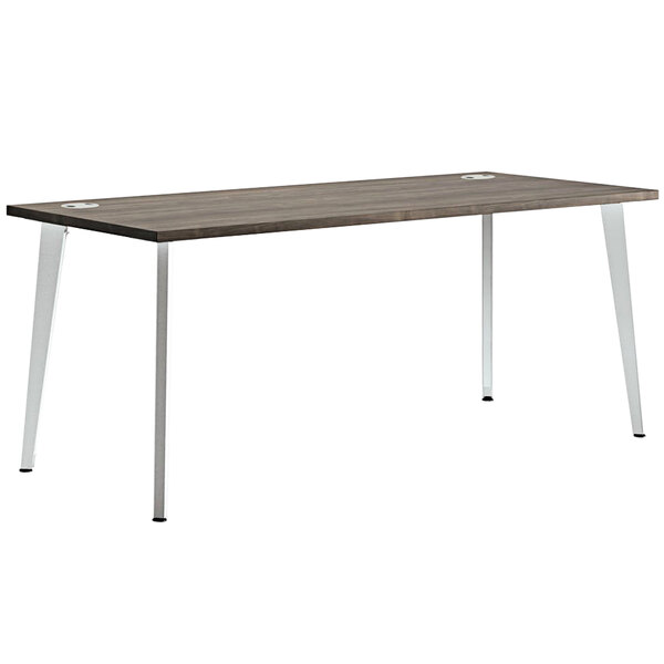 A HON Voi Florence Walnut desk with metal legs.