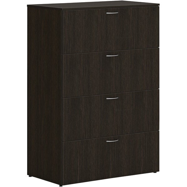 A dark brown wooden HON lateral filing cabinet with 4 drawers.