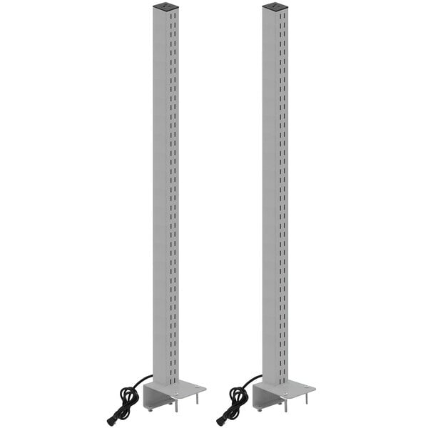 A pair of gray metal BenchPro uprights with power plugs on each.