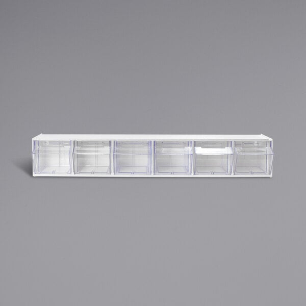 A white Deflecto interlocking tilt-bin organizer with clear drawers.