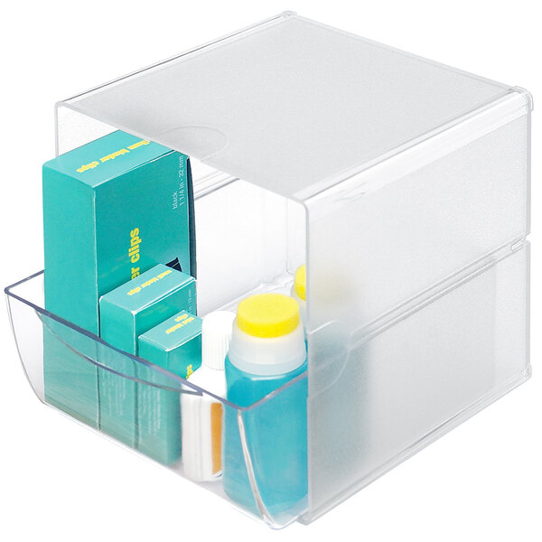 A clear plastic container with a drawer inside.