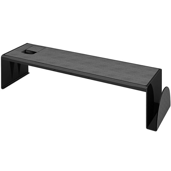 A black desk with a Deflecto black metal desk shelf on it.