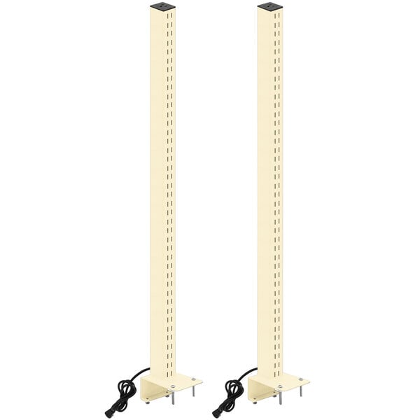 A pair of white metal uprights with a black power plug.