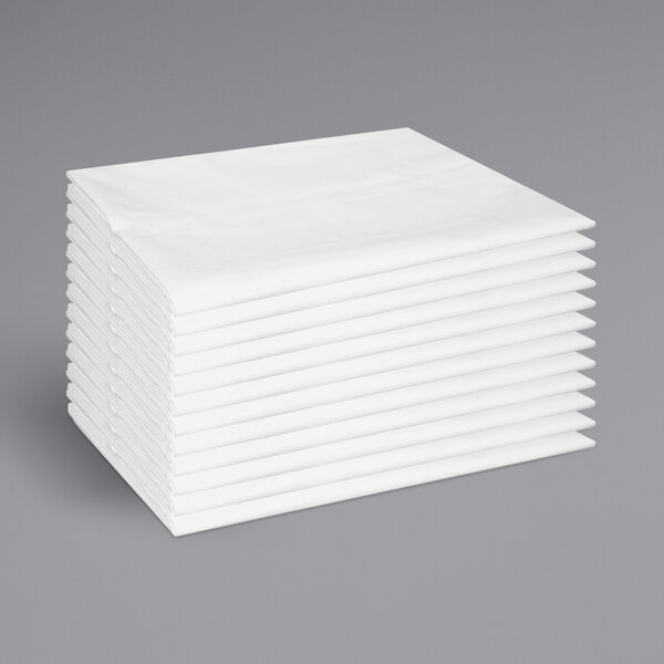 A stack of white Monarch Brands pillowcases.