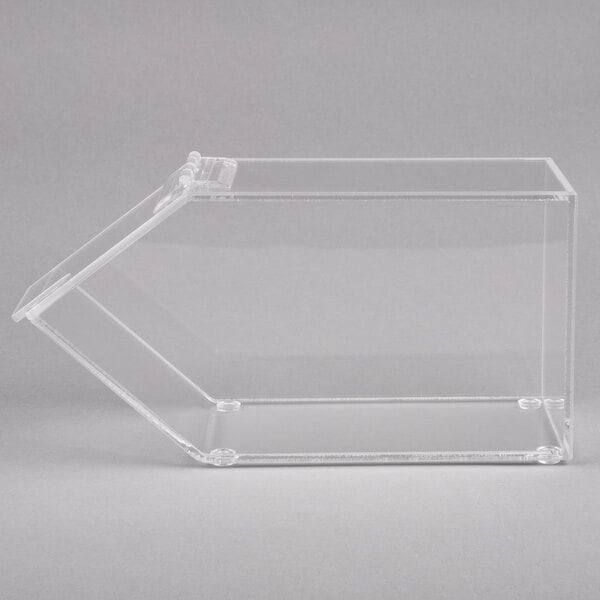 A clear plastic Cal-Mil topping dispenser with a notch lid on a counter.