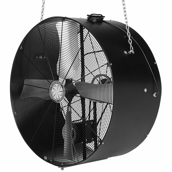 A large black TPI suspension blower hanging from a chain.