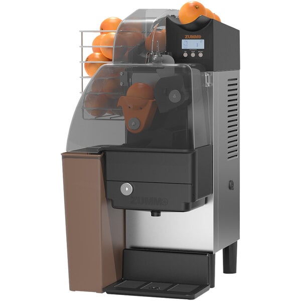 A Zummo Nature Compact Brown commercial orange juicer with oranges in it.