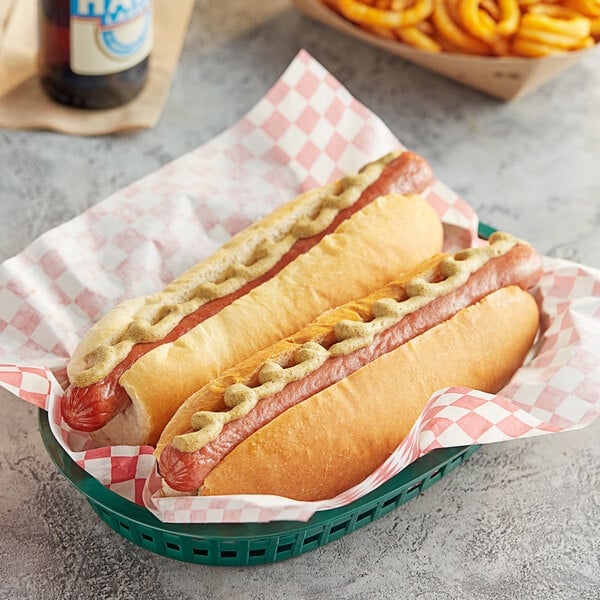 A basket of Nathan's Famous beef hot dogs with mustard.