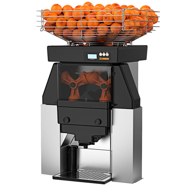 A Zummo commercial juicer with oranges in the top.