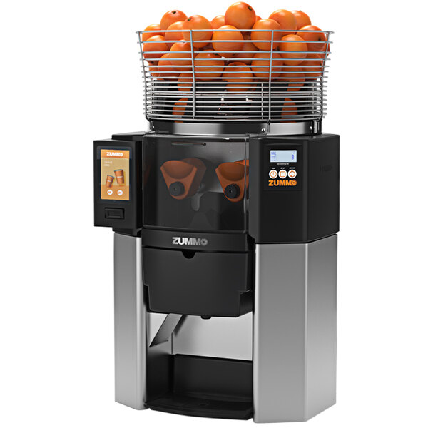 A Zummo Z14 commercial juicer with oranges in a basket.