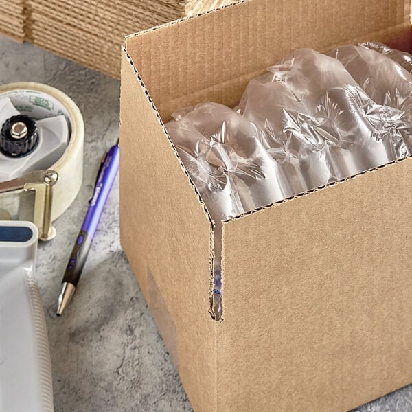 A Kraft cardboard shipping box with clear plastic bottles inside.