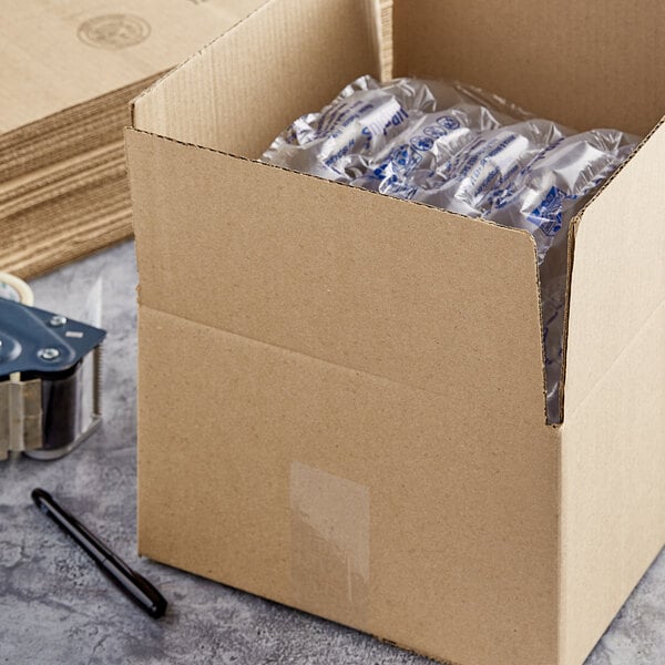 A Lavex kraft cardboard shipping box with clear plastic wrap inside.