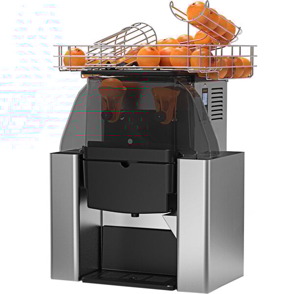 A Zummo Z06 commercial juicer with oranges on top.